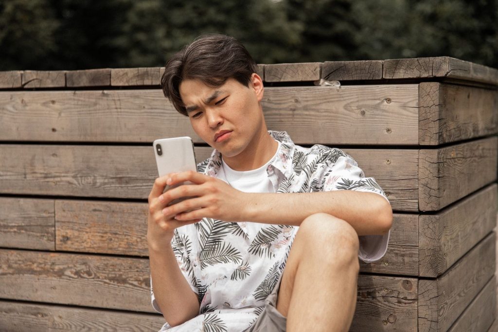 Man Looking At Phone 1024x683